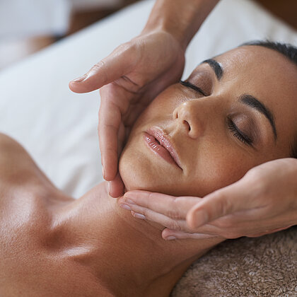 Shot of an attractive woman enjoying a face massage