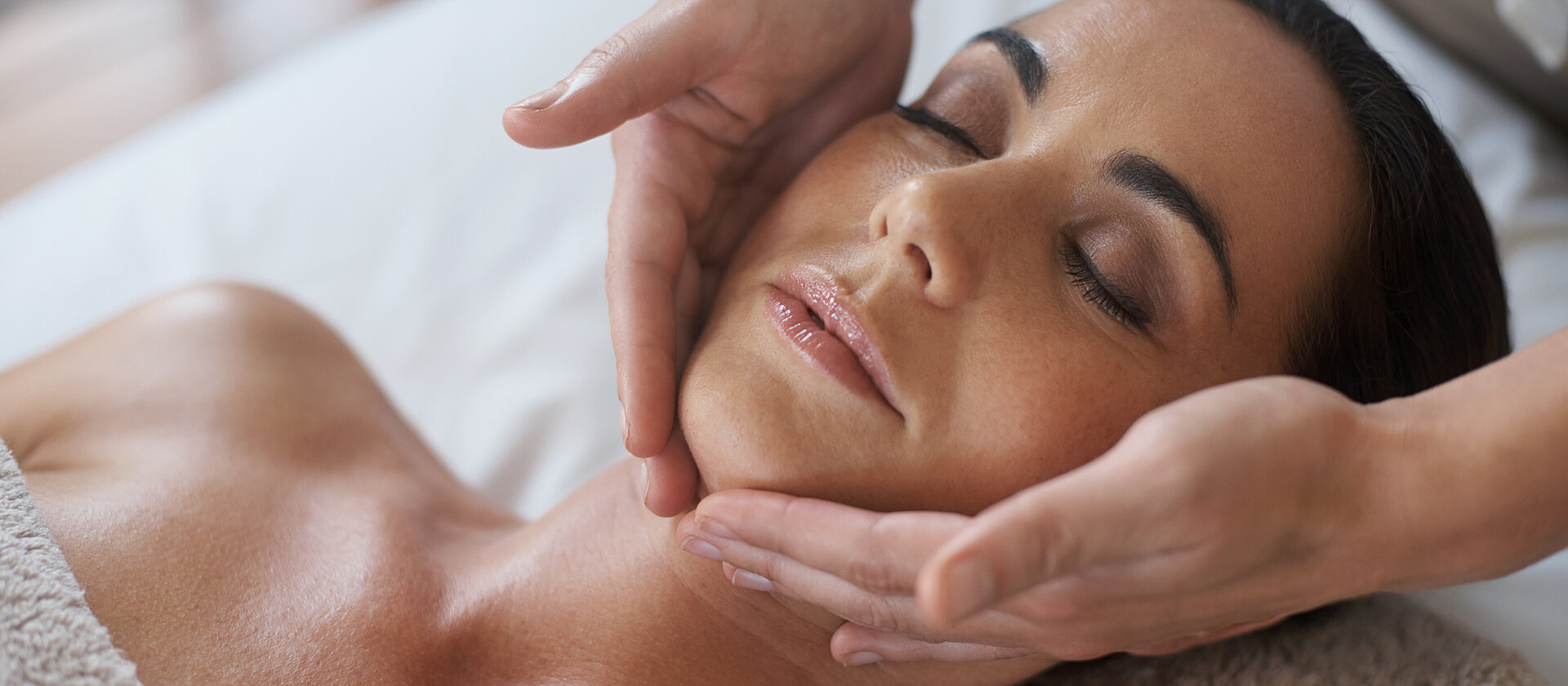 Shot of an attractive woman enjoying a face massage
